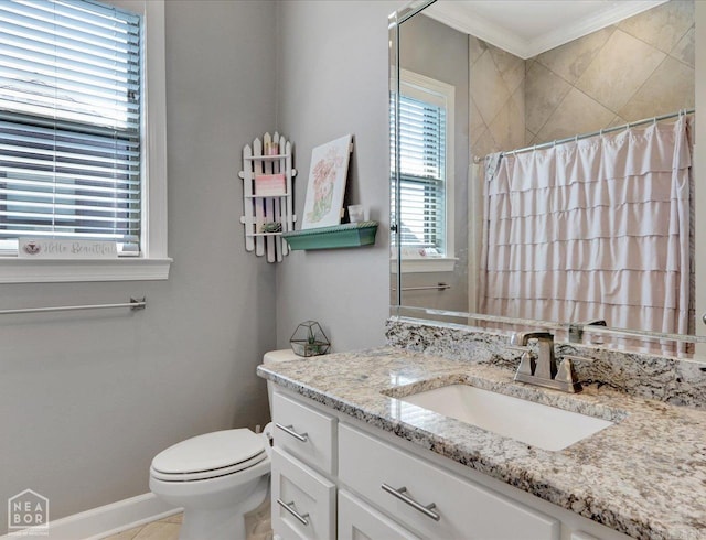 bathroom with crown molding, toilet, and vanity