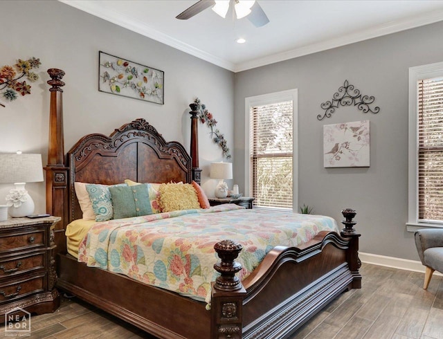 bedroom with ceiling fan, crown molding, light wood-type flooring, and multiple windows