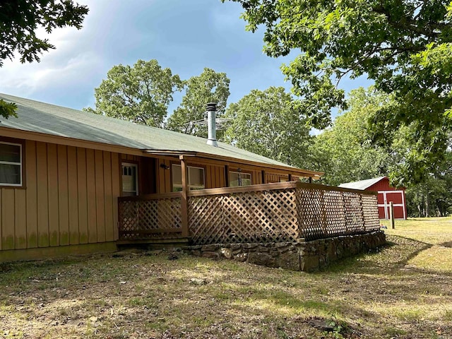 rear view of property with a yard