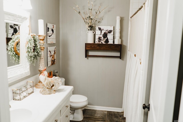 bathroom with vanity and toilet