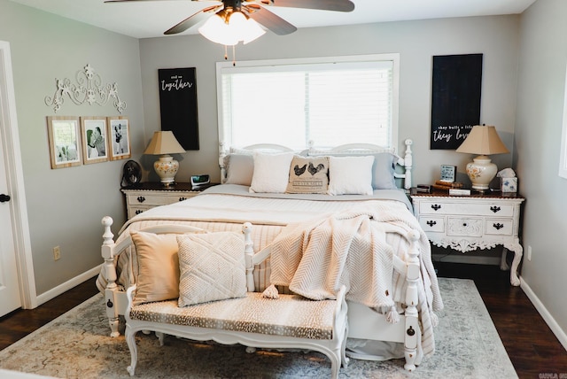 bedroom with ceiling fan and dark hardwood / wood-style flooring