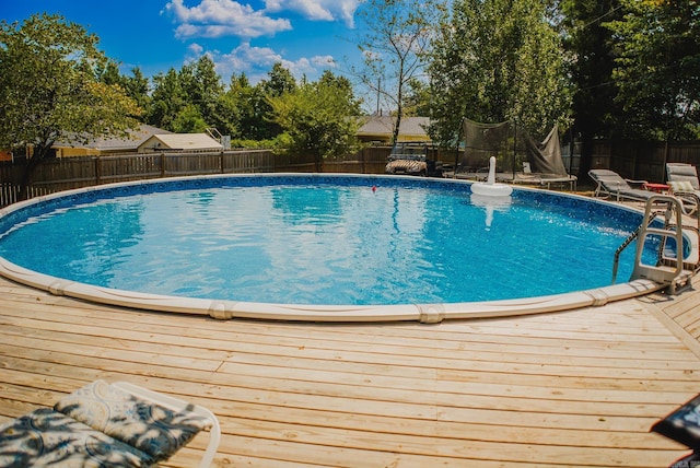 view of swimming pool with a deck