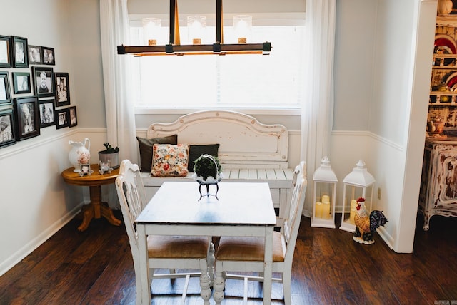 bedroom with baseboards and wood finished floors