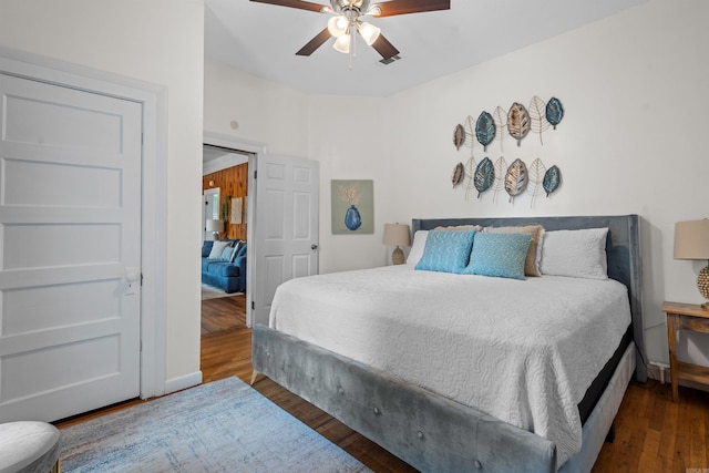 bedroom featuring ceiling fan and wood-type flooring