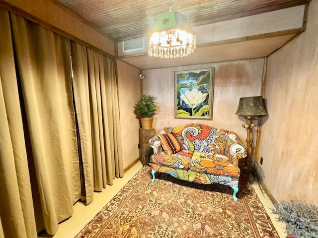 sitting room featuring a chandelier