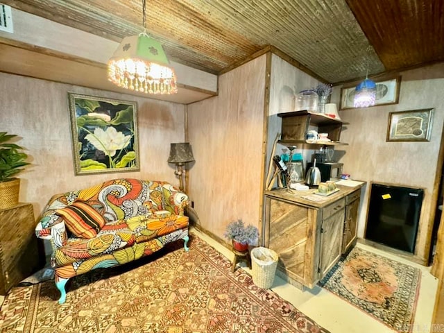 1499 Sutterfield Rd, Fox, AR 72051 - living room featuring wooden ceiling, a chandelier, and wooden walls