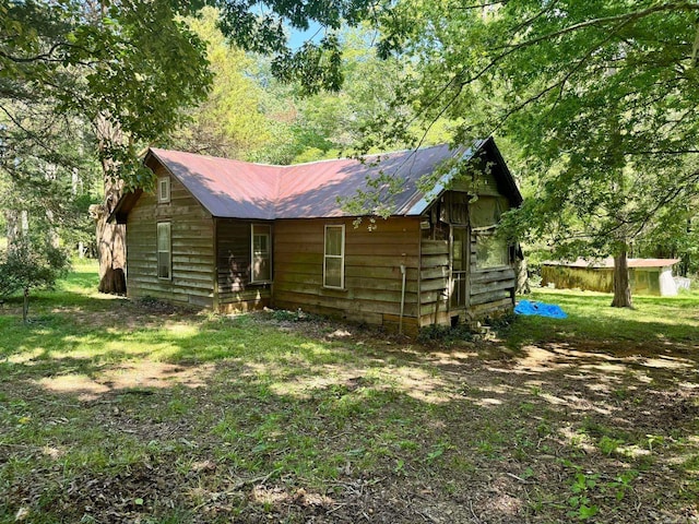 1499 Sutterfield Rd, Fox, AR 72051 - rear view of property with metal roof