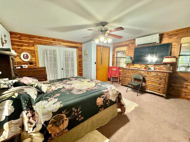 bedroom with wood walls, ceiling fan, a wall mounted AC, and light carpet