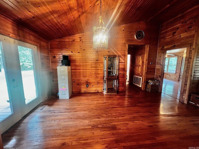 interior space with vaulted ceiling, wood-type flooring, wooden walls, and wood ceiling