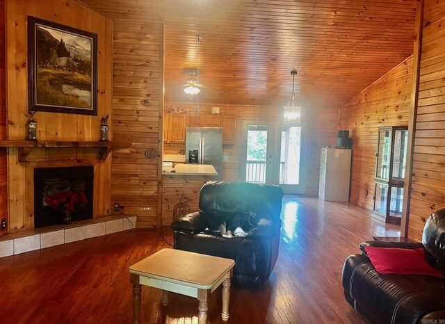 interior space with hardwood / wood-style flooring and tiled tub