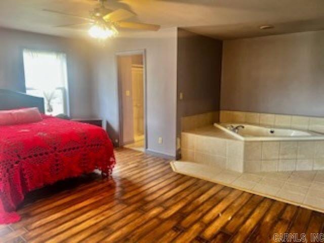 bedroom featuring ceiling fan and wood-type flooring