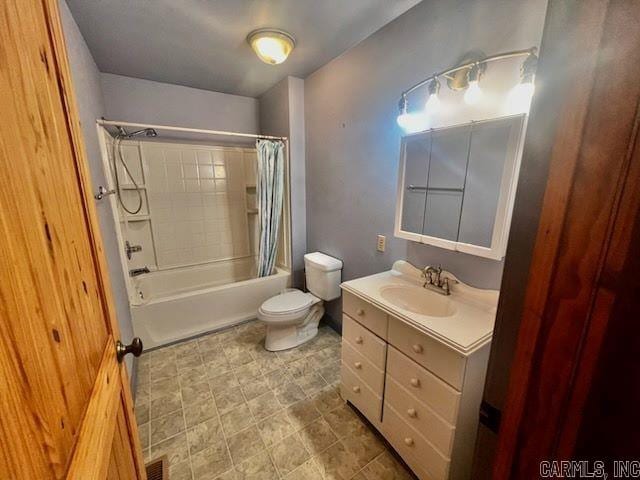 full bathroom with toilet, shower / tub combo, visible vents, and vanity