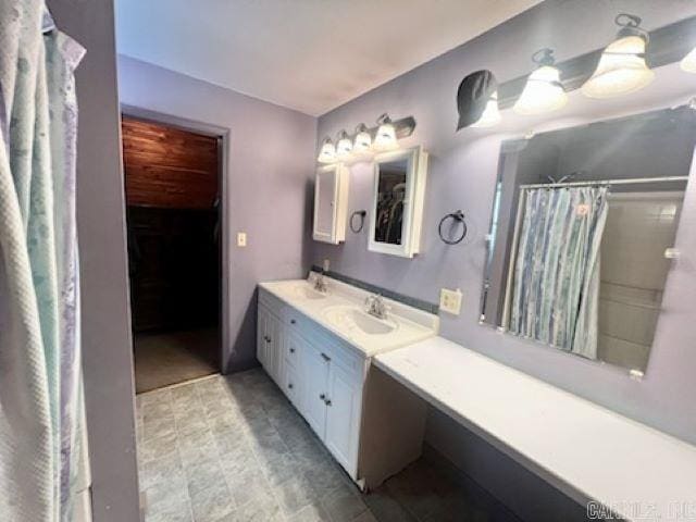 full bathroom with a shower with shower curtain and vanity