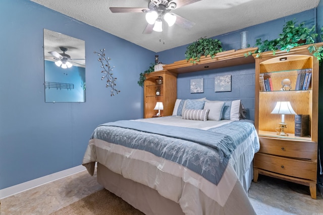 carpeted bedroom with ceiling fan and a textured ceiling