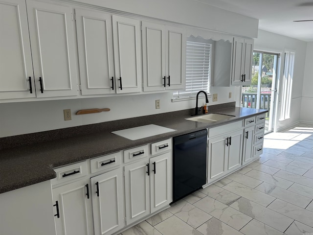 kitchen with black dishwasher, white cabinets, light tile patterned floors, and sink