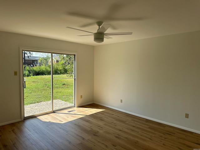 spare room featuring ceiling fan and hardwood / wood-style floors