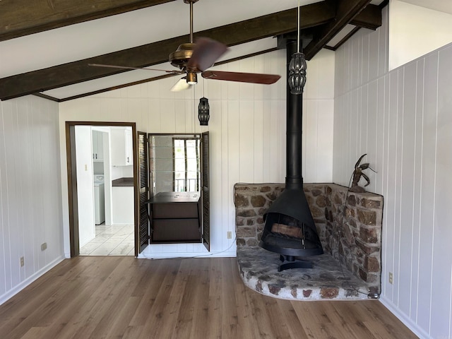 interior space with ceiling fan