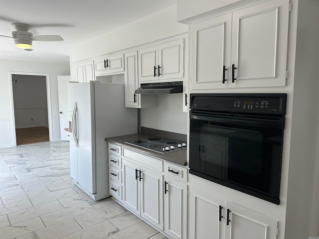 kitchen with ceiling fan, electric cooktop, oven, and white cabinetry