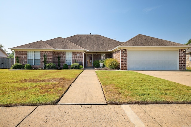 single story home featuring a front lawn and a garage