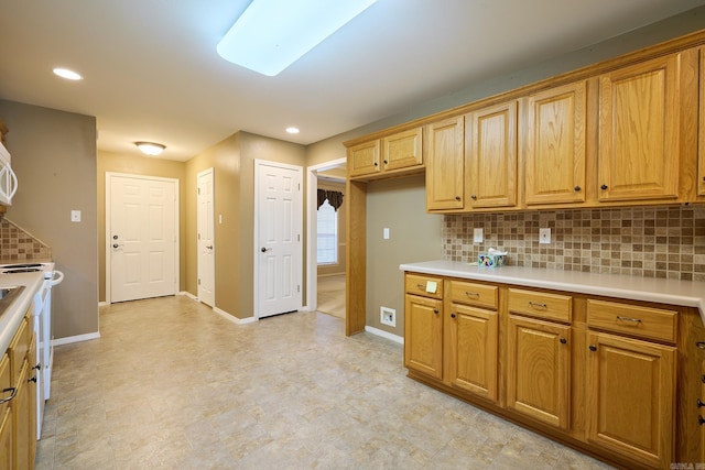 kitchen featuring decorative backsplash and white electric range