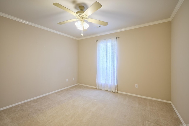 spare room with light colored carpet, ceiling fan, and ornamental molding