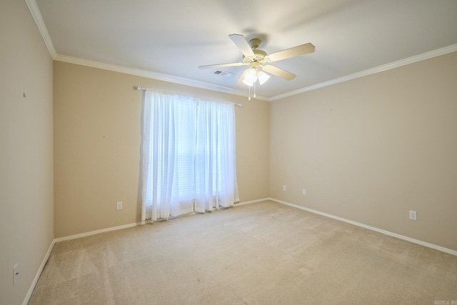 carpeted empty room with ceiling fan and crown molding