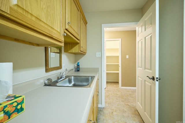 kitchen featuring light brown cabinetry and sink