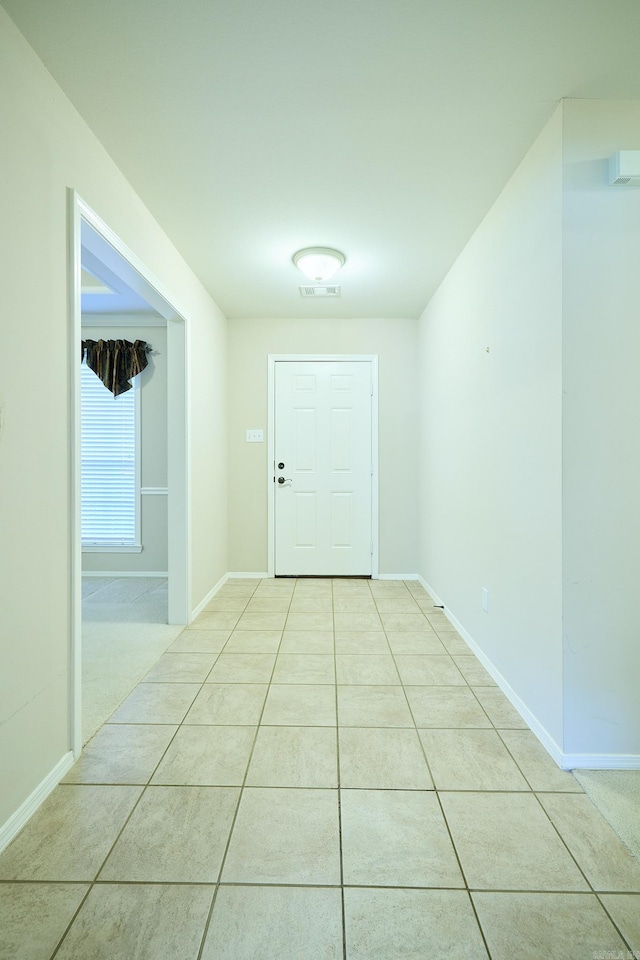 interior space with light tile patterned floors