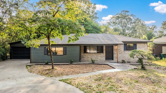 ranch-style home featuring a garage