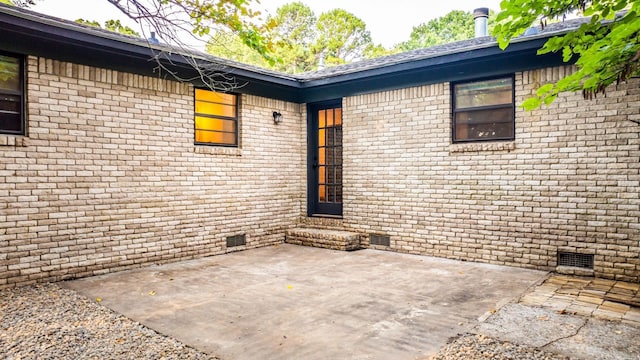 doorway to property featuring a patio area