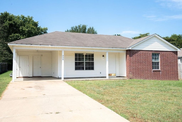 single story home featuring a front lawn and a carport