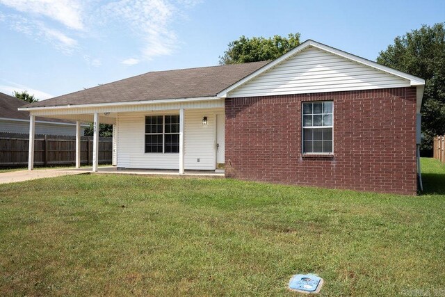 ranch-style house with a front lawn