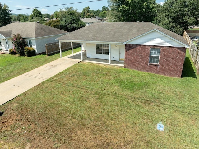 ranch-style home featuring a front yard