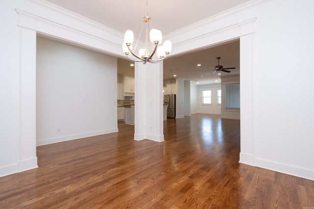 unfurnished room with hardwood / wood-style flooring, ceiling fan with notable chandelier, and ornamental molding