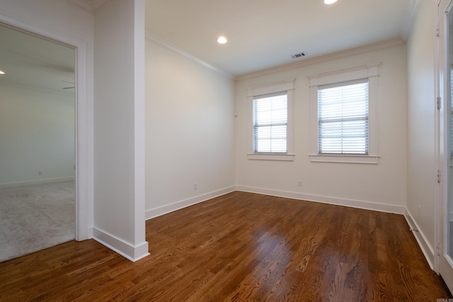 carpeted spare room featuring ornamental molding