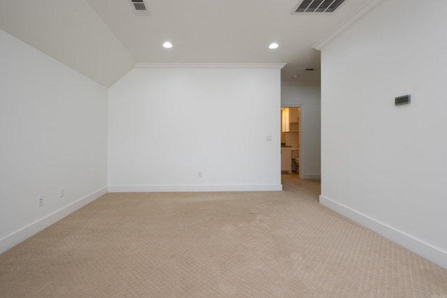 empty room with light colored carpet and crown molding