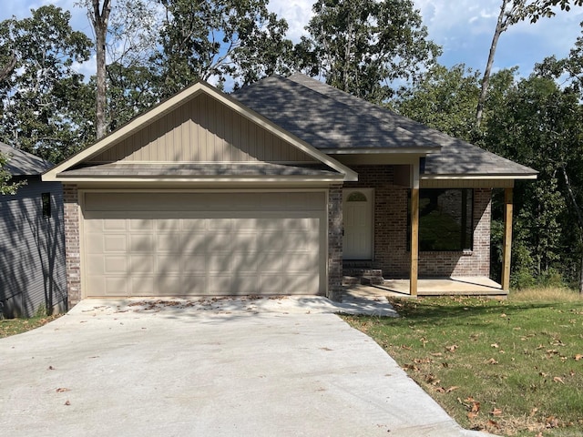 single story home featuring a garage and a front lawn