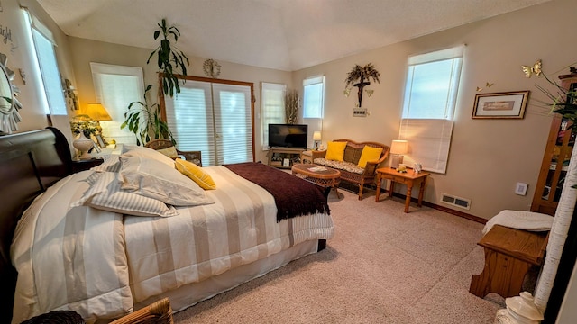 bedroom featuring baseboards, visible vents, and light carpet