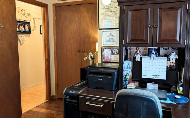 office with wood-type flooring