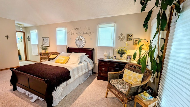 bedroom featuring light carpet