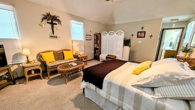 carpeted bedroom featuring multiple windows