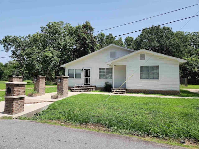 ranch-style house with a front lawn