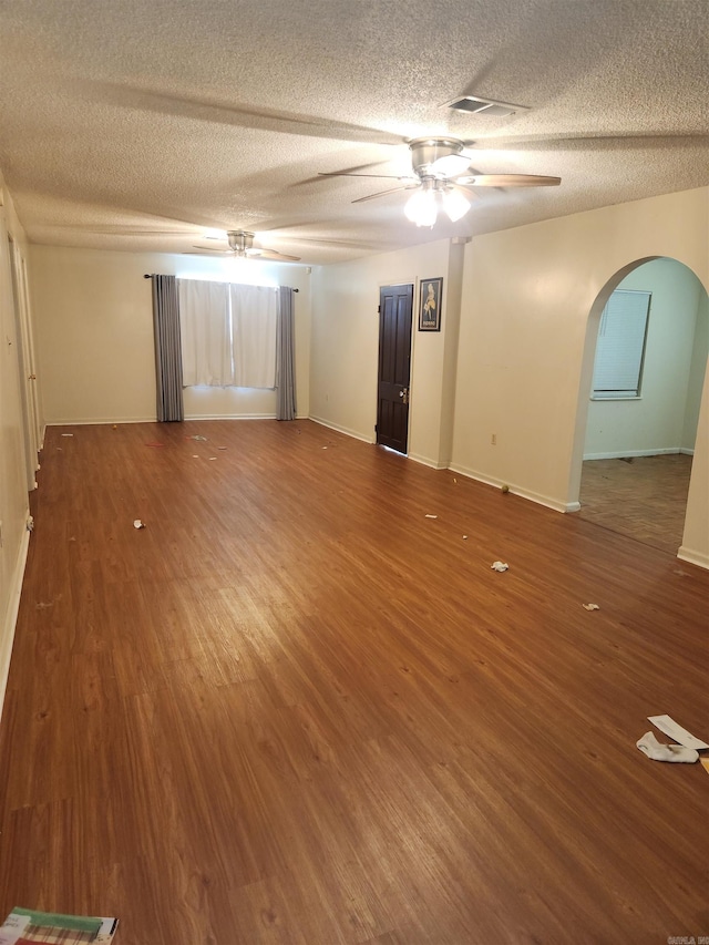 unfurnished bedroom featuring a textured ceiling and hardwood / wood-style flooring