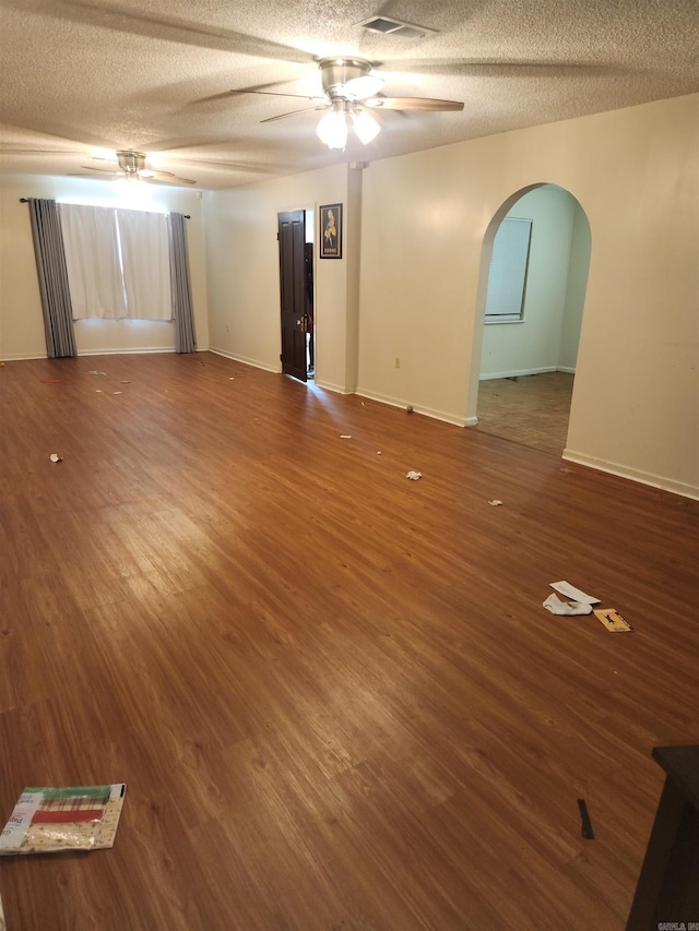 unfurnished room featuring ceiling fan, a textured ceiling, and hardwood / wood-style floors