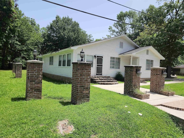 view of front of home with a front yard