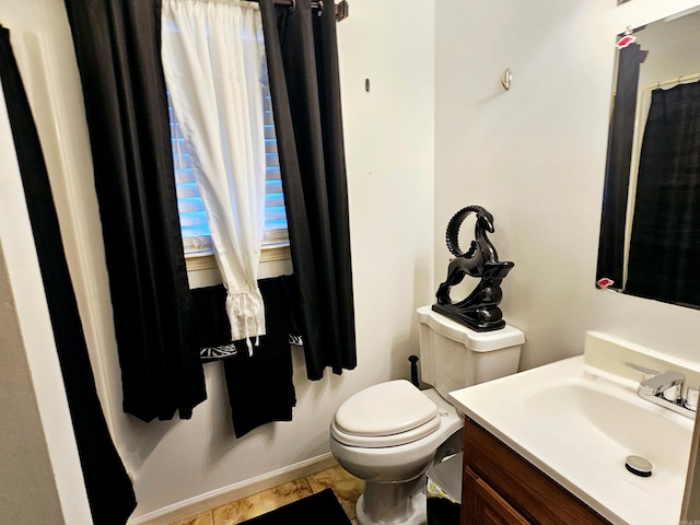 full bath with toilet and vanity