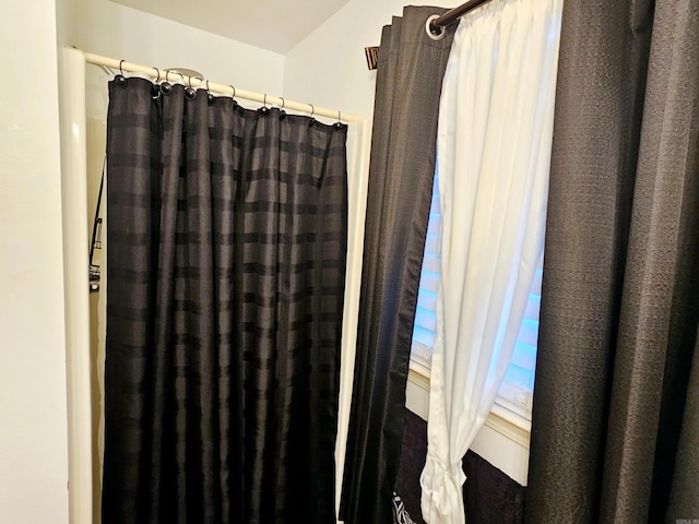 interior details featuring curtained shower