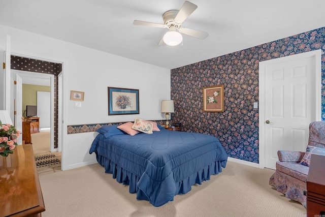 carpeted bedroom with a ceiling fan, wallpapered walls, and baseboards