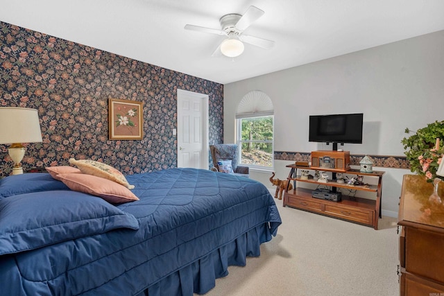carpeted bedroom featuring a ceiling fan and wallpapered walls