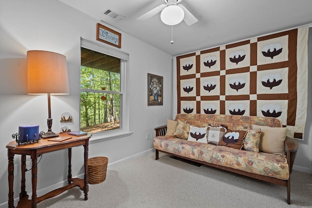 living area featuring carpet, visible vents, ceiling fan, and baseboards